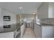 Spacious modern kitchen features stainless steel appliances, breakfast bar, and ample cabinet space at 8117 Bay Dr, Tampa, FL 33635