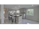 The bright kitchen features a breakfast bar, modern cabinets, and stainless steel appliances at 8117 Bay Dr, Tampa, FL 33635