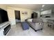 Open floorplan with modern living room and updated kitchen with breakfast table at 8117 Bay Dr, Tampa, FL 33635