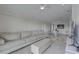 Comfortable living room area featuring a couch, tv, and dining area at 8117 Bay Dr, Tampa, FL 33635