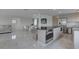 Spacious living area that seamlessly connects to a stylish kitchen and dining space, perfect for entertaining at 8117 Bay Dr, Tampa, FL 33635