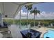 Enjoy the breeze and the backyard from this elevated patio, complete with a pool and lounge area at 8117 Bay Dr, Tampa, FL 33635