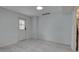 Bright, spacious room features tiled floors and natural light from the door at 8117 Bay Dr, Tampa, FL 33635