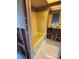 Bathroom featuring yellow tile, a bathtub and tile flooring and is ready for renovation at 8422 Boxwood Dr, Tampa, FL 33615