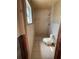 Modest bathroom featuring tile shower and walls, awaiting renovation at 8422 Boxwood Dr, Tampa, FL 33615