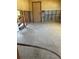 Bonus room with cement flooring and walls ready for renovation to make your own at 8422 Boxwood Dr, Tampa, FL 33615
