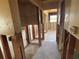 Hallway with tile flooring and exposed wall studs ready for renovation to make your own at 8422 Boxwood Dr, Tampa, FL 33615