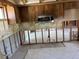 Kitchen area with stainless microwave, tile flooring, cabinets, and ready for renovation at 8422 Boxwood Dr, Tampa, FL 33615