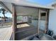 View of the screened-in porch with table and tile flooring at 8422 Boxwood Dr, Tampa, FL 33615