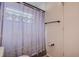 Bathroom with shower featuring patterned curtain and modern fixtures at 8913 Welsh Way, Hudson, FL 34667