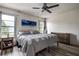 Bright and airy bedroom with wood flooring and large windows for natural light at 8913 Welsh Way, Hudson, FL 34667
