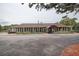 Well-maintained community building with landscaped grounds and ample parking, perfect for social gatherings at 8913 Welsh Way, Hudson, FL 34667