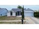 Beautiful single-Gathering home with well-maintained landscaping, attached garage, and inviting curb appeal at 8913 Welsh Way, Hudson, FL 34667
