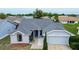 Charming single-story home with a well-maintained lawn and a new gray roof at 8913 Welsh Way, Hudson, FL 34667