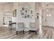 Foyer with decorator furniture and decor with luxury vinyl plank flooring throughout at 8913 Welsh Way, Hudson, FL 34667