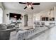 Comfortable living room with modern furnishings and a view of the open-concept kitchen at 8913 Welsh Way, Hudson, FL 34667