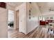 Bright living room featuring wood flooring, a high ceiling, and cozy seating arrangement at 8913 Welsh Way, Hudson, FL 34667