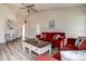 Cozy living room features LVP floors, neutral paint, ceiling fan and designer coffee table at 8913 Welsh Way, Hudson, FL 34667