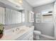 Stylish bathroom featuring a modern vanity, tile floors, and a shower-tub combination at 895 Joan St, Dunedin, FL 34698