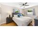 Comfortable bedroom with natural light, wood floors, and contemporary furnishings at 895 Joan St, Dunedin, FL 34698