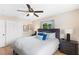 Bedroom featuring natural light, wood floors, and contemporary furnishings at 895 Joan St, Dunedin, FL 34698