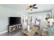 Spacious living room with stylish furnishings, tile flooring, and an open layout at 895 Joan St, Dunedin, FL 34698