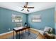 Bright home office with hardwood floors, two windows, and a functional workspace at 895 Joan St, Dunedin, FL 34698