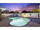 Twilight view of the swimming pool and patio with a beautiful dusk sky and lights at 895 Joan St, Dunedin, FL 34698