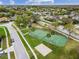 Aerial view of community featuring tennis court and playground at 9220 Dayflower Dr, Tampa, FL 33647
