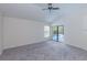 Spacious bedroom featuring carpet floors and access to a screened-in pool area at 9220 Dayflower Dr, Tampa, FL 33647