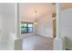 Bright dining room featuring column accents, wood flooring, and modern chandelier at 9220 Dayflower Dr, Tampa, FL 33647