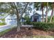 Charming single-story home features lush landscaping and an attached two-car garage at 9220 Dayflower Dr, Tampa, FL 33647