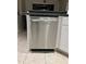 Modern kitchen featuring a sleek stainless steel dishwasher with shaker cabinets at 9220 Dayflower Dr, Tampa, FL 33647