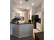 Bright kitchen features white cabinets, stainless steel appliances, and tiled floors for easy maintenance at 9220 Dayflower Dr, Tampa, FL 33647
