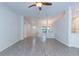 Open-concept living room features light gray wood-look floors and a bright, airy atmosphere at 9220 Dayflower Dr, Tampa, FL 33647