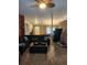 Inviting living room area showcasing a large sectional sofa and dining area at 9220 Dayflower Dr, Tampa, FL 33647