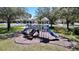 A blue and grey playground offers residents a great neighborhood amenity at 9220 Dayflower Dr, Tampa, FL 33647