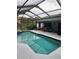 Relaxing screened-in pool area with covered patio, great for entertaining at 9220 Dayflower Dr, Tampa, FL 33647