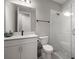 Bathroom featuring a glass-enclosed shower, modern vanity with white cabinets, and a toilet at 923 Whimbrel Run, Bradenton, FL 34212