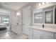 Bright bathroom with dual sinks, white cabinets, stylish fixtures, and lots of counter space at 923 Whimbrel Run, Bradenton, FL 34212