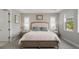 Relaxing bedroom with tray ceilings, bedside tables, and serene decor at 923 Whimbrel Run, Bradenton, FL 34212