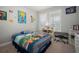 Themed bedroom with playful decorations and a comfortable bed and a view outside at 923 Whimbrel Run, Bradenton, FL 34212