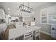 Open-concept dining area with views into the kitchen and living room at 923 Whimbrel Run, Bradenton, FL 34212
