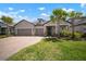 Charming single-Gathering home with a two-car garage, brick paver driveway, and meticulously maintained lawn at 923 Whimbrel Run, Bradenton, FL 34212
