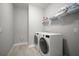 Laundry room featuring side-by-side washer and dryer and a white wire shelf at 923 Whimbrel Run, Bradenton, FL 34212