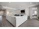 Spacious living room with fireplace, TV, and comfortable seating at 923 Whimbrel Run, Bradenton, FL 34212
