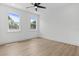 Bedroom featuring a ceiling fan, and two windows at 925 E Chelsea St, Tampa, FL 33603