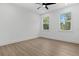 Bedroom featuring a ceiling fan, and two windows at 925 E Chelsea St, Tampa, FL 33603