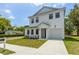 Two story home exterior with a manicured lawn and easy access driveway at 925 E Chelsea St, Tampa, FL 33603