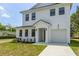 Beautiful two-story home features a pristine lawn and attached two car garage at 925 E Chelsea St, Tampa, FL 33603